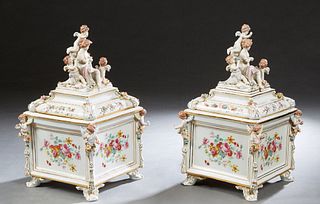 Pair of Porcelain Meissen Style Covered Square Garniture Boxes, 20th c., the lid with a figural surmount of a woman, a putti and a peacock, to a slopi