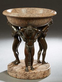 Marble and Bronze Centerbowl, 20th c., the large circular figured tan marble bowl upheld by three patinated bronze kneeling Atlas figures, on a thick 