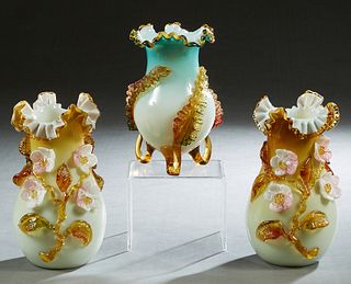 Three Stevens and Williams Art Glass Cased Vases, 20th c., consisting of a pair of pale yellow baluster vases with applied floral and leaf decoration 