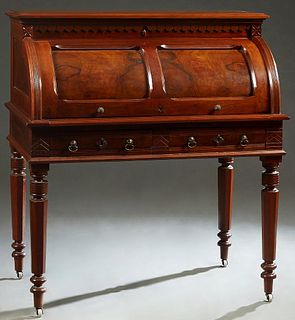 American Eastlake Carved Walnut Cylinder Desk, c. 1890, the stepped sloping rectangular top over a cylinder top opening to a pull out baize writing su