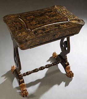 English Chinoiserie Black Lacquer Work Table, 19th c., the shaped rounded corner lid with elaborate gilt decoration, opening to a compartmented interi