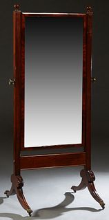 English Georgian Style Carved Mahogany Cheval Mirror, c. 1900 the framed rectangular plate on finial topped tapered square supports, joined by a large