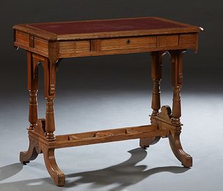 American Carved Oak Writing Table, late 19th c., the stepped canted corner top with an inset red leather writing surface, over a long frieze drawer, o
