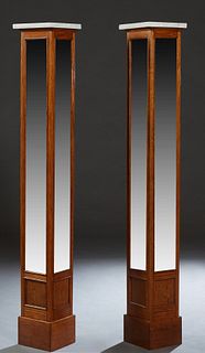 Pair of American Tall Oak Marble Top Pedestals, late 19th c., the figured square white marble atop rectangular sides fitted with four wide beveled mir