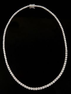 18K White Gold Tennis Necklace, each of the 126 links with a graduated round diamond, total diamond wt.- 21.05 cts., L.- 17 in., with appraisal.