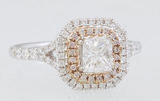 Lady's 18K White Gold Dinner Ring, with a .54 rectangular diamond atop two concentric graduated octagonal borders of tiny round diamonds, the split sh