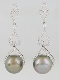 Pair of Platinum Pendant Earrings, the pierced diamond mounted stud to a diamond mounted heart shaped link, suspending a 13mm dark gray Tahitian cultu