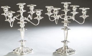 Pair of Ornate Georgian Style Silverplated Five Light Candelabra, 20th c., with a center straight candle cup and four swirled arms, all with relief sq