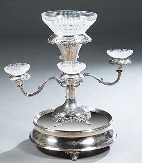 Silverplated Epergne/Centerpiece, with a crystal bowl centering four scrolled arms with relief candlecups and bobeches, removable to use four crystal 