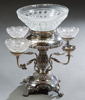 Silverplate on Copper Epergne/Centerpiece, early 20th c., with a center crystal bowl on a relief leaf support, issuing four scrolled arms with three c