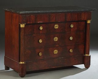 French Empire Ormolu Mounted Carved Mahogany Marble Top Commode, 19th c., the figured black marble over a frieze drawer and three setback drawers, fla