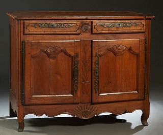 French Provincial Louis XV Style Carved Cherry Sideboard, 19th c., the ogee edge canted corner over two frieze drawers with iron escutcheons, over fie