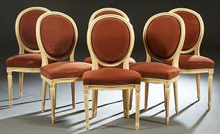Set of Six French Louis XVI Style Carved Polychromed Beech Dining Chairs, the curved oval upholstered back over a bowed upholstered seat, on turned ta