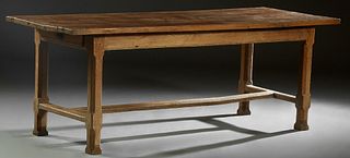 French Provincial Carved Oak Farmhouse Table, 19th c., the rectangular five board top over a wide skirt, on chamfered trestle bases joined by an H-for