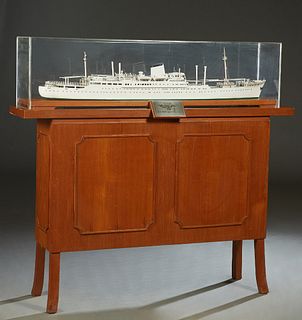 M. V. "Mer Abeto," 1952, metal ship's model by Chantiers et Ateliers De Penhoet, St. Nazaire, with a plexiglass case, on a carved mahogany stand, on s