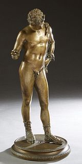 Continental School, "Classical Male Athlete," 19th c., gilt bronze figure on an integral stepped circular base with relief borders, probably a Grand T