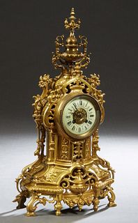 French Gilt Bronze Mantel Clock, late 19th c., with an urn surmount atop a pierced case with a painted enamel dial time and strike Japy Freres clock, 