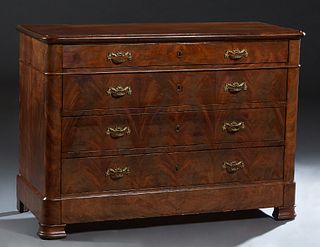 French Provincial Louis Philippe Carved Walnut Commode, 19th c., the rounded edge and corner top over a setback frieze drawer and three deep drawers, 
