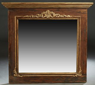 Provincial Gilt and Walnut Overmantle Mirror, late 19th c., the stepped crown over a gilt applied floral and scroll frieze joining an applied relief g