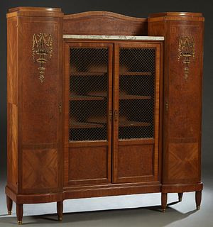 French Art Nouveau Ormolu Mounted Inlaid Burled Walnut Marble Top Bookcase, c. 1920, the central arched back over a figured white marble above double 