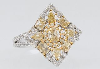 Lady's 14K Yellow and White Gold Dinner Ring, the center of the square top with an oval fancy yellow diamond within a border of white diamonds and a p
