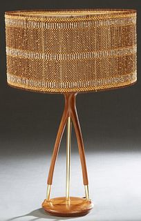 Mid-Century Modern Teak and Brass Table Lamp, 20th c., the open wood "wishbone" support with a central brass rod, on a sloping circular base, with a M