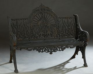 Ornate Reticulated Cast Iron Bench, 20th/21st c., the center fan back with a shell and scroll crest over a pierced trefoil eminating rays, flanked by 