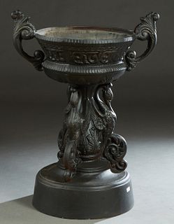 Large Cast Aluminum Baluster Jardiniere, 20th/21st. c., with large scrolled relief handles, on a triple swan support, to a stepped circular base, H.- 