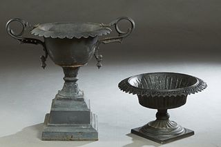 Two Cast Iron Campana Form Jardinieres, 19th c., by the G. R. Walbridge Co, Buffalo, N. Y., one with a scalloped rim and ring handles, on a stepped sq