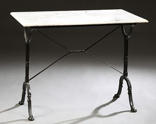 Parisian Marble Top Wrought Iron Bistro Table, early 20th c., the ogee edge rectangular figured white marble on wrought iron trestle supports joined b