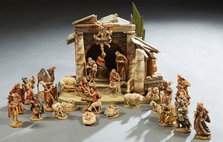 Thirty-One Piece Carved Wood Nativity Set, 20th c., most by Anri, consisting of a manger, an angel, 3 wise men, 3 Baby Jesus in a crib, 2 Virgin Marys