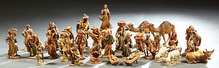 Large Group of Thirty-One Anri Carved Wood Nativity Figures, 20th c., Italy, consisting of Joseph, the Virgin Mary, Baby Jesus in a crib, 3 wise man, 