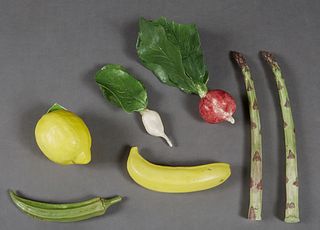 Mary Kirk Kelly (1918-2003, Alabama), Group of Seven Porcelain Fruits and Vegetables, consisting of a banana, a lemon, a turnip, a radish, two asparag