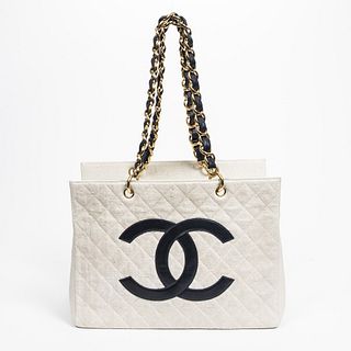 Chanel Large CC Logo Chain Tote Shoulder Bag, in ivory quilted canvas and navy blue leather accents, opening to a white leather lined interior with on