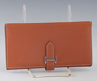 Hermes Bearn Wallet, in tan Epsom calf leather with silver hardware, opening to a calf leather lined interior with four bill pockets, five card slots,