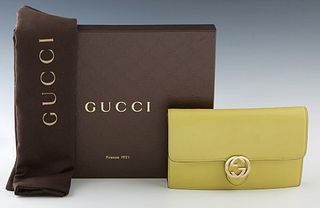 Gucci Icon Wallet Crossbody Bag, in lime green smooth calf leather with gold hardware, the snap button closure opening to a lined dark brown satin lin