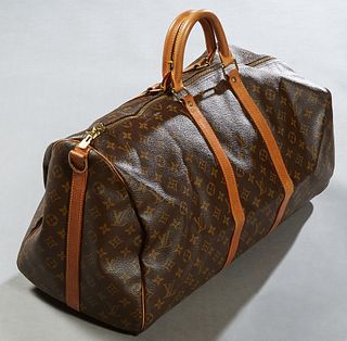 Louis Vuitton Keepall Bandouliere 55 Travel Bag, in brown monogram coated canvas with Vachetta handles and golden brass hardware, opening to a brown c