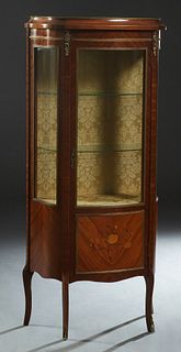 French Ormolu Mounted Inlaid Mahogany Vitrine, 20th c., the ogee edge top over a center door with a curved glass upper panel and a lower marquetry inl