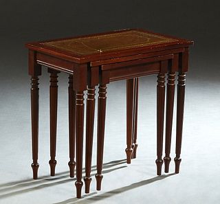 Nest of Three French Louis XVI Style Carved Beech Tables, 20th c., the gilt tooled leather inset tops on turned tapered reeded legs, Largest- H.- 20 1