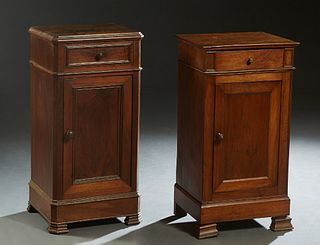 Two French Louis Philippe Carved Walnut Nightstands, one with a canted corner top over a frieze drawer and a cupboard door, on a plinth base on ogee b