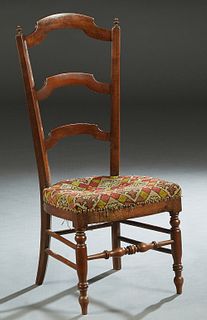 French Provincial Carved Walnut Slipper Chair, 19th c., the canted curved arched ladder back over a bowed seat, on turned tapered legs joined by turne