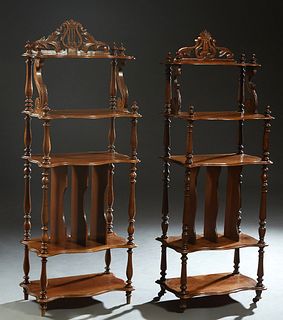 Near Pair of French Carved Walnut Etageres, c. 1880, with a scrolled crest over a finialed shelf on scrolled supports, to two graduated shelves on tur