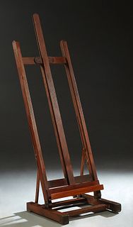 French Carved Beech Adjustable Artist's Easel, early 20th c., on a trestle base joined by stretchers, H.- 64 in., W.- 21 1/2 in., D.- 19 in.