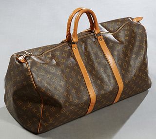 Louis Vuitton Keepall 55 Travel Bag, in brown monogram coated canvas with Vachetta leather accents and golden brass hardware, opening to a brown canva