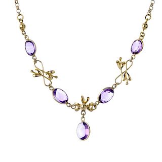 An amethyst necklace and locket. To include an oval-shape amethyst necklace with foliate spacers and
