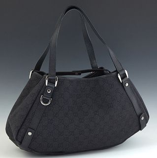 Gucci Abbey Diagonal Like Hobo Bag, in black monogrammed canvas with black leather accents and ruthenium hardware, opening to a black canvas lined int