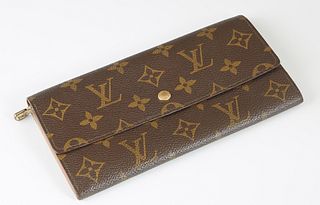 Louis Vuitton Porte-Monnaie Wallet, in brown monogram coated canvas with golden brass hardware, the snap button closure opening to a chocolate brown c