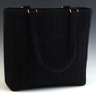 Chanel Choco Bar Tote Bag, in black choco bar canvas with gold hardware, opening to a black suede lined interior with a side zip closure pocket, accom
