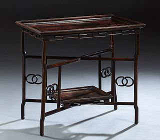 Chinese Carved Hardwood Ming Style Two Tier Mahjong Table, 20th c., the dished rectangular tray top on a folding trestle base stand with a lower dishe