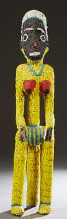 African Beaded Female Figure, 20th c., Cameroon, of a woman on a stool, H.- 36 1/2 in., W.- 7 3/4 in., D.- 7 in.